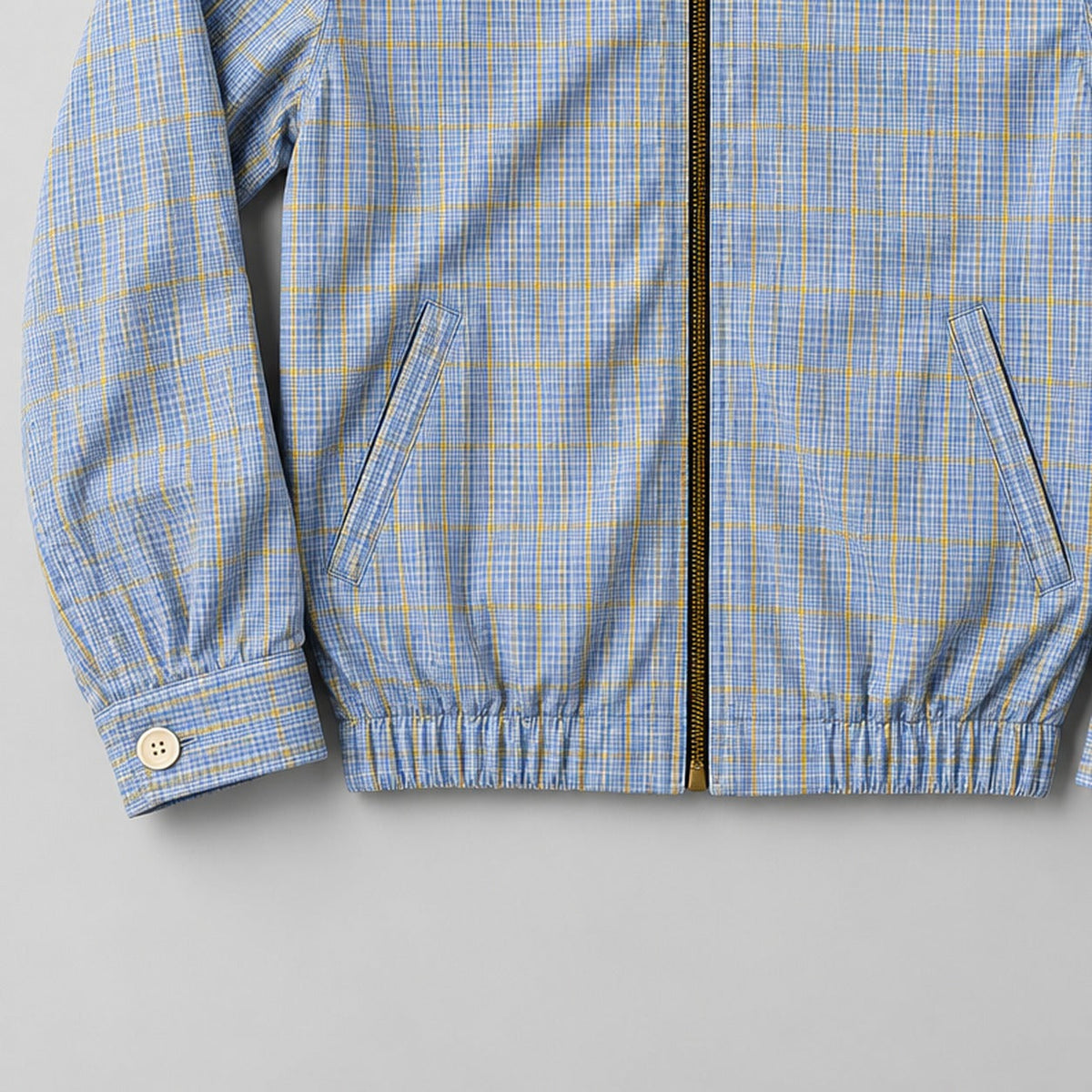 Ralph Lauren upcycled blue-yellow-check: gestileerd AI-detail van mouw en zoom
