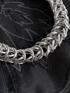 Arum sculptural chainmail bracelet showing interwoven stainless steel links