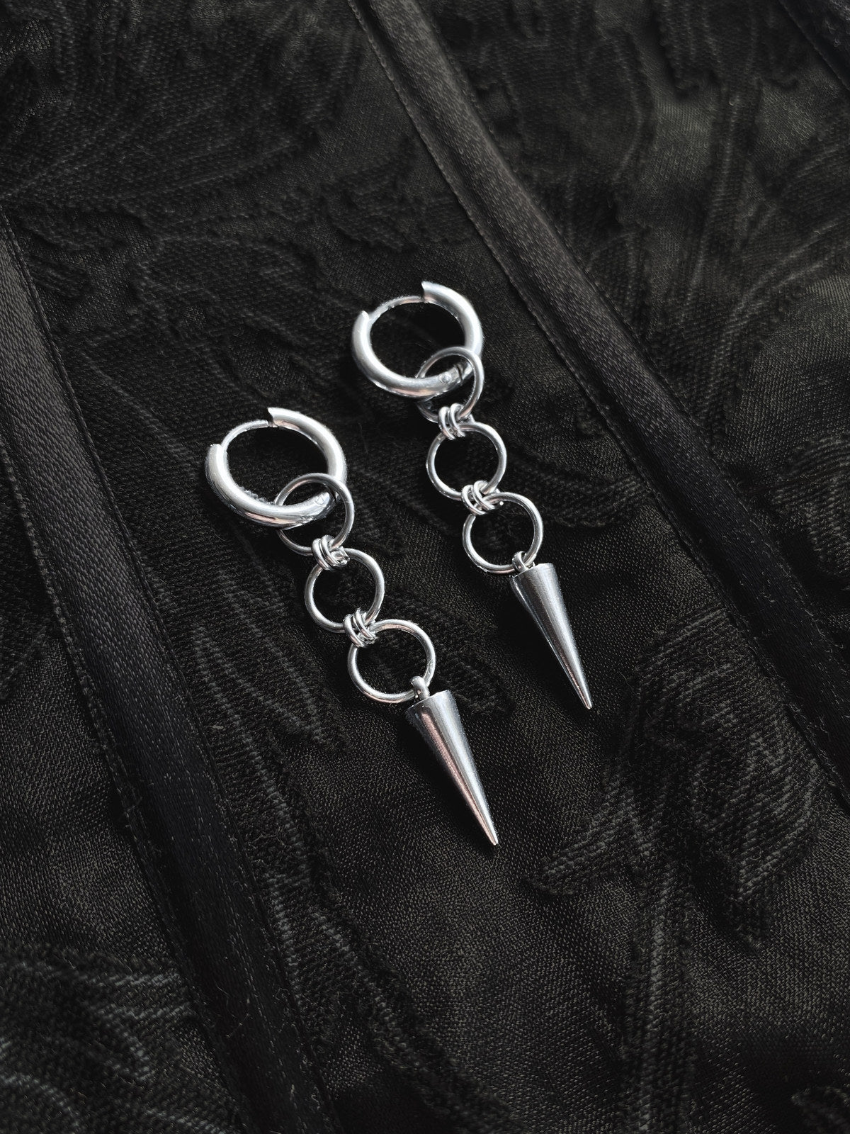 Detail photograph of handmade Solanum steel earrings